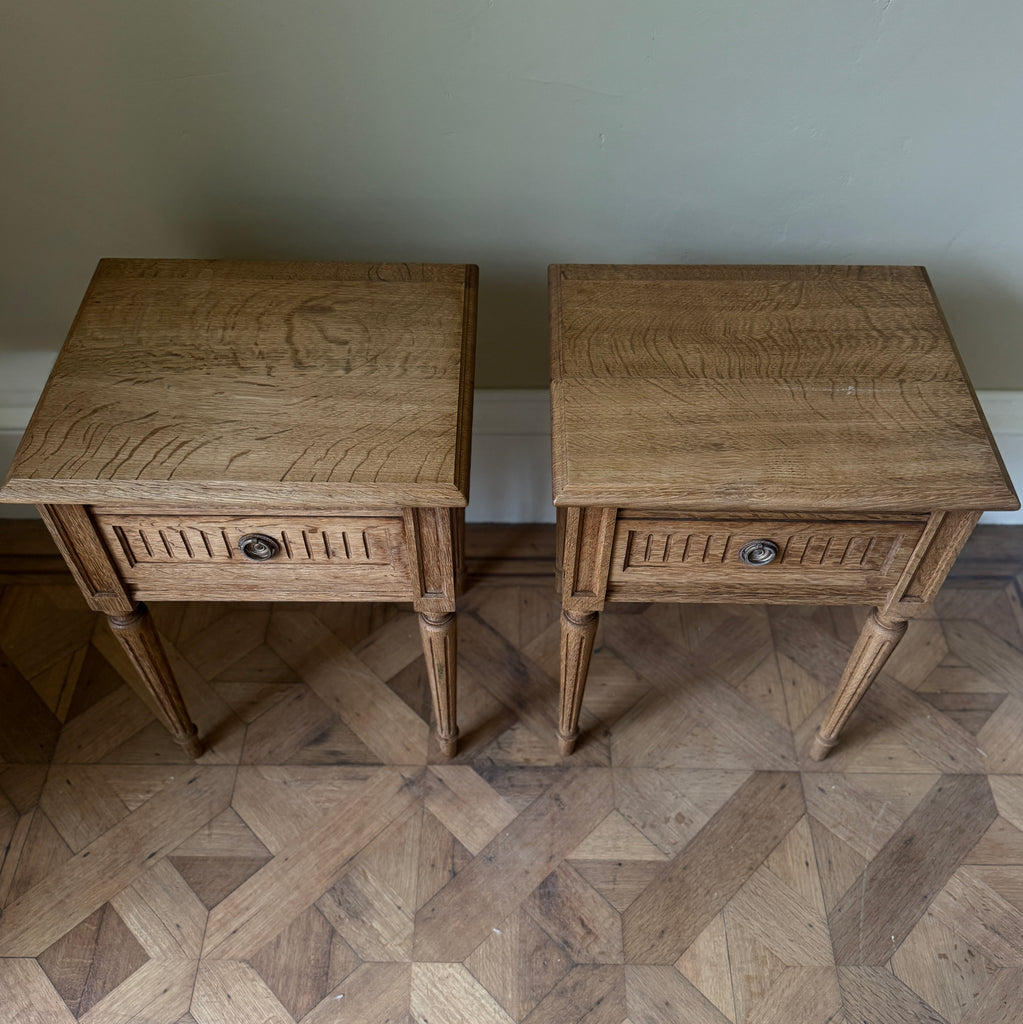 Two wooden side tables with a drawer each, ring pull handles, tapered legs
