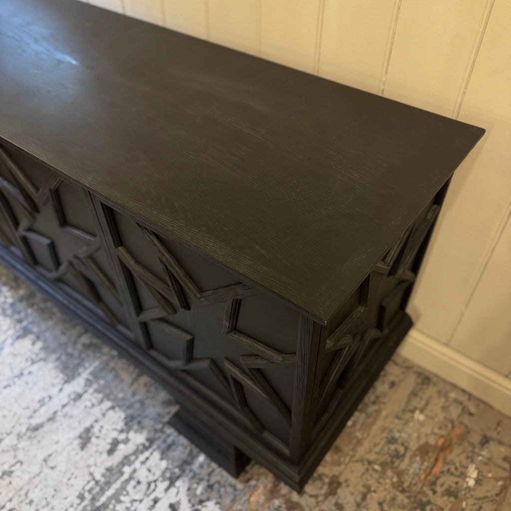 Black decorative cabinet with star patterns, ebonised oak, star motif