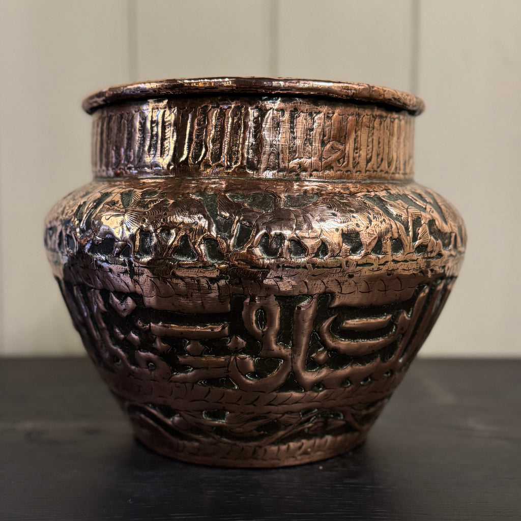Decorative bronze vase with intricate patterns, persian planter