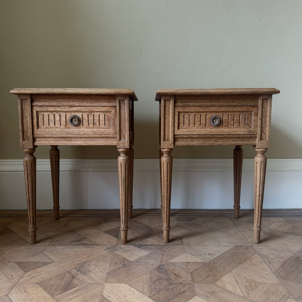 Two wooden side tables with a drawer each, ring pull handles, tapered legs
