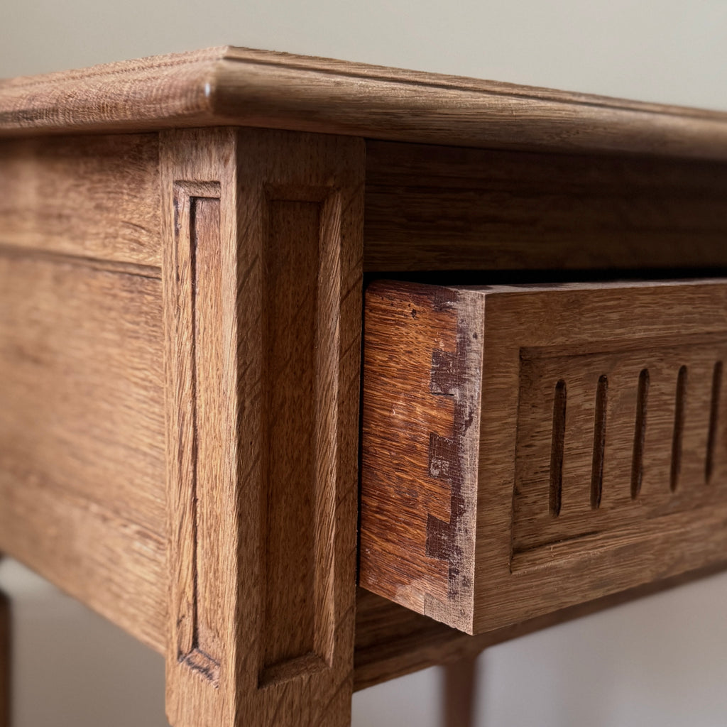 Two wooden side tables with a drawer each, ring pull handles, tapered legs, dovetail drawers