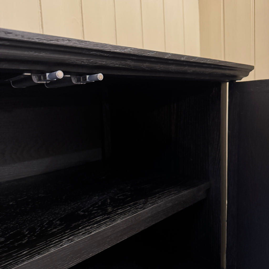 Black decorative cabinet with star patterns, ebonised oak, star motif