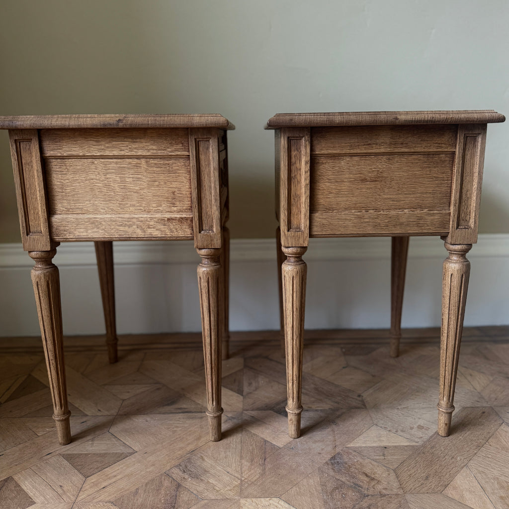Two wooden side tables with a drawer each, ring pull handles, tapered legs
