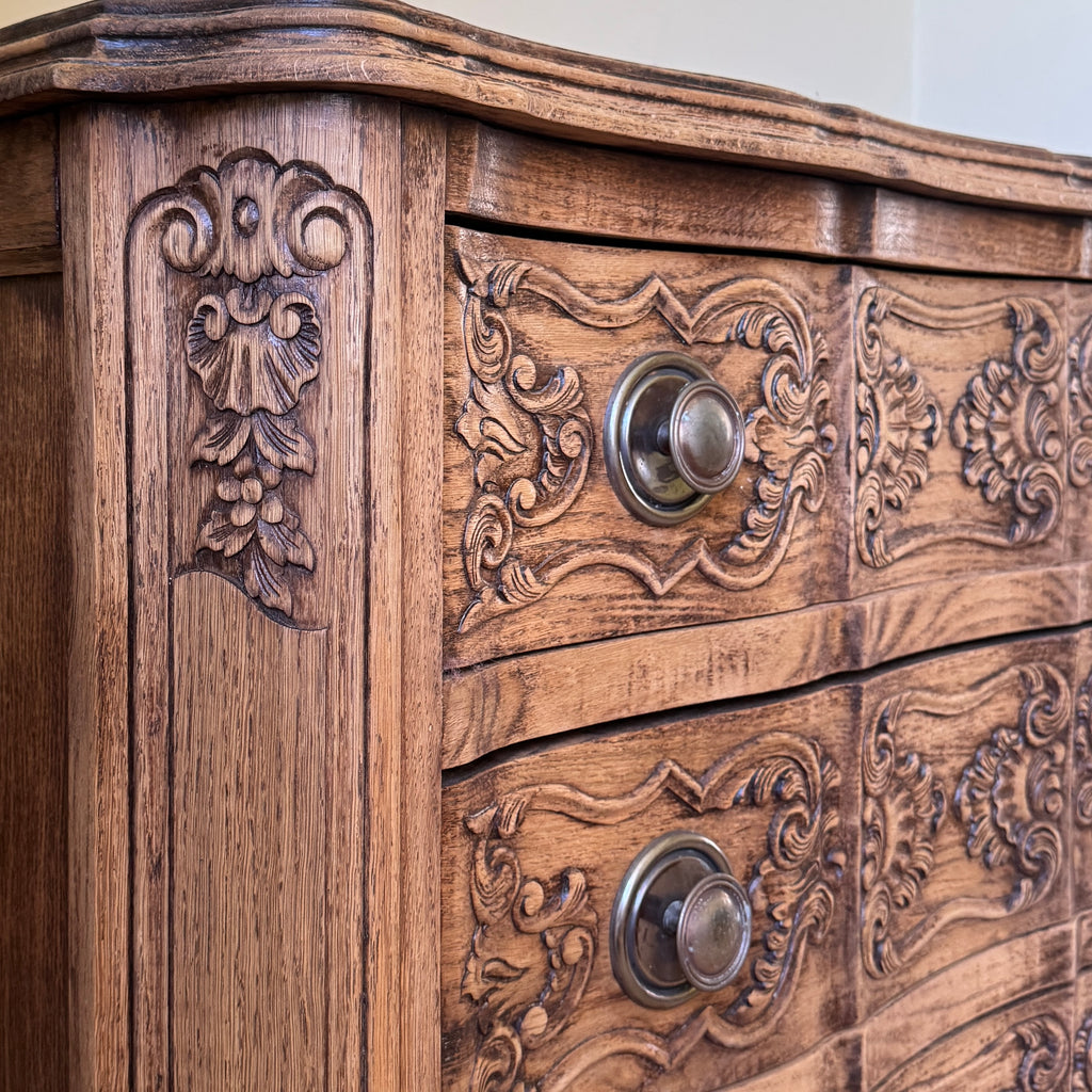 French Wooden cabinet with intricate carvings and metal handles