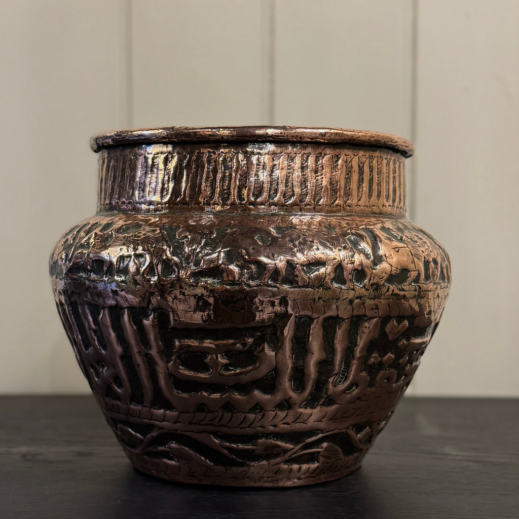 Decorative bronze vase with intricate patterns, persian planter