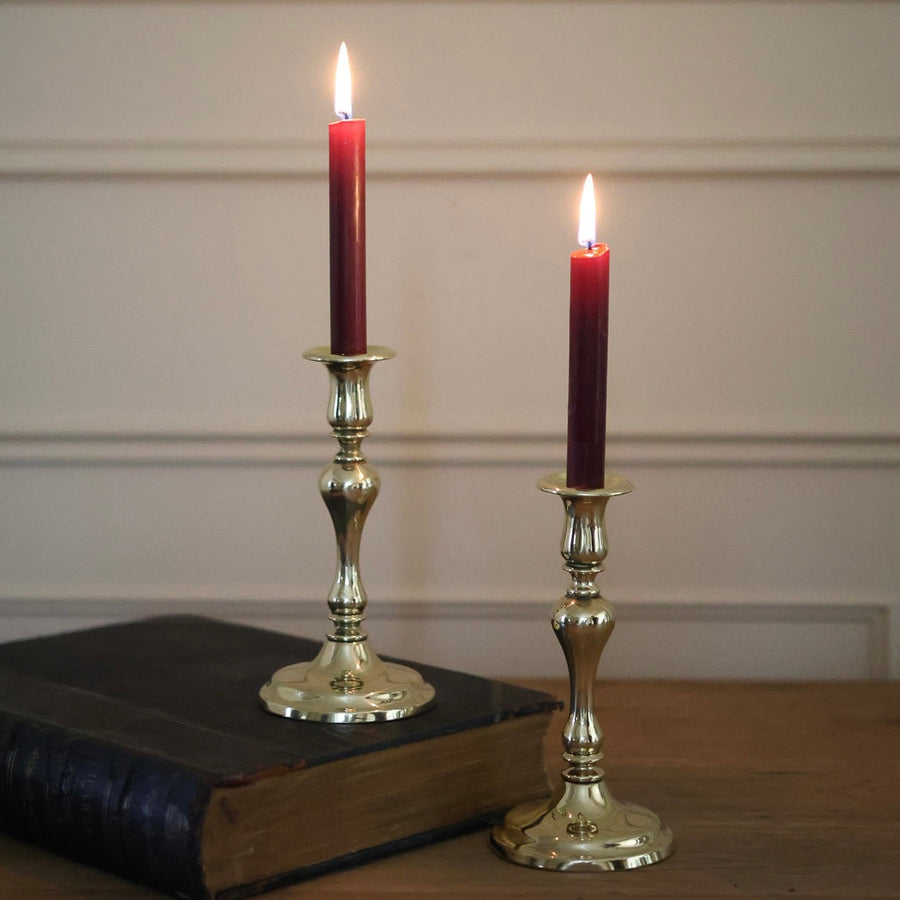 A pair of Polished Brass Antique Candleholders