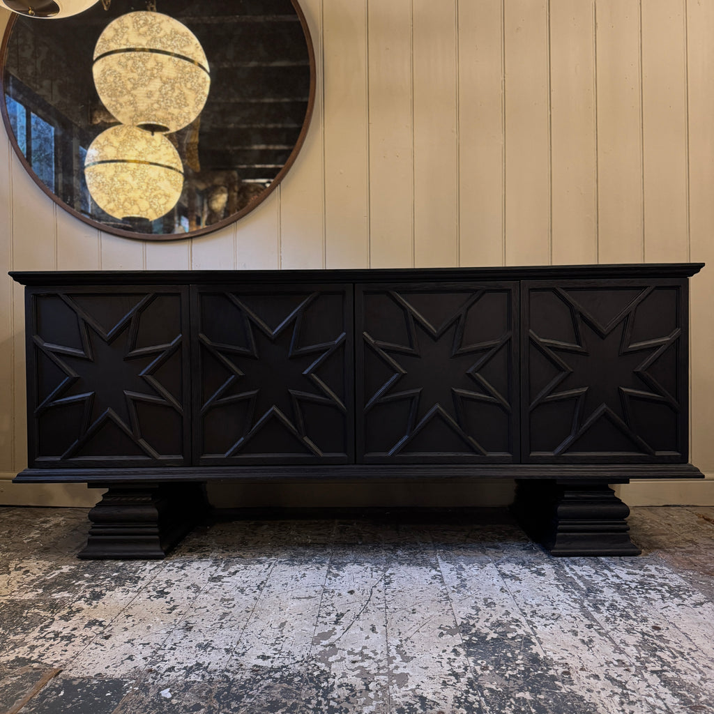Black decorative cabinet with star patterns, ebonised oak, star motif