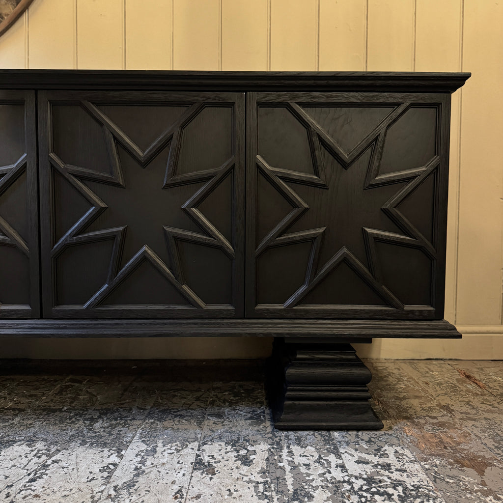 Black decorative cabinet with star patterns, ebonised oak, star motif