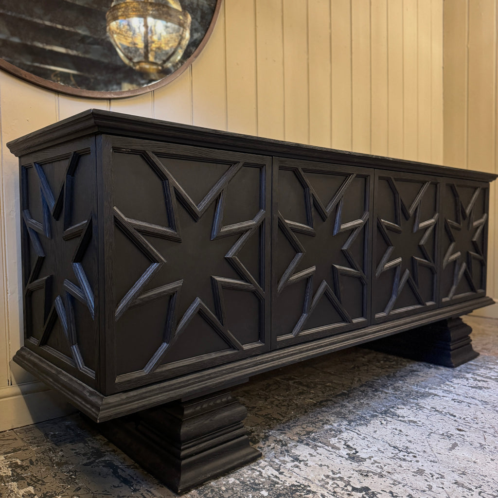 Black decorative cabinet with star patterns, ebonised oak, star motif